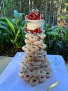 Naked cake with fresh strawberries wedding donut tower