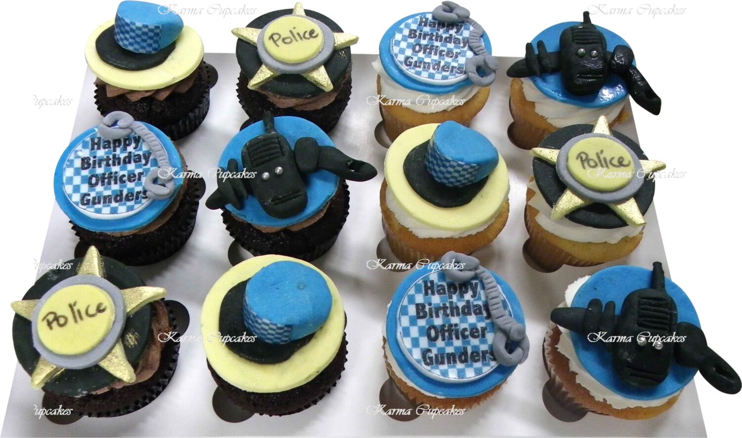 Police themed cupcakes with handmade sugar pieces