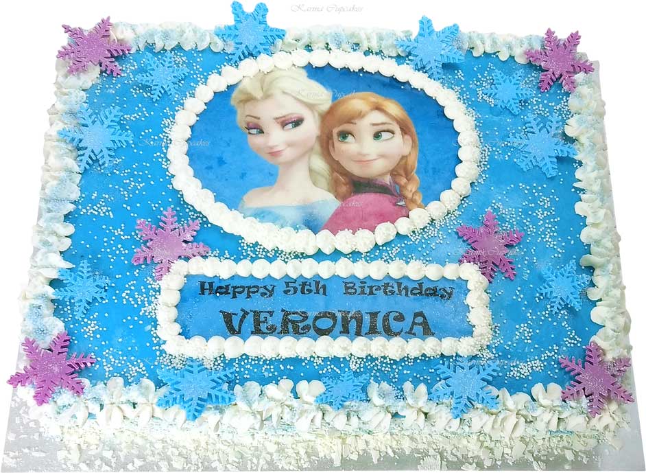 Frozen half slab buttercream iced cake with snow flakes
