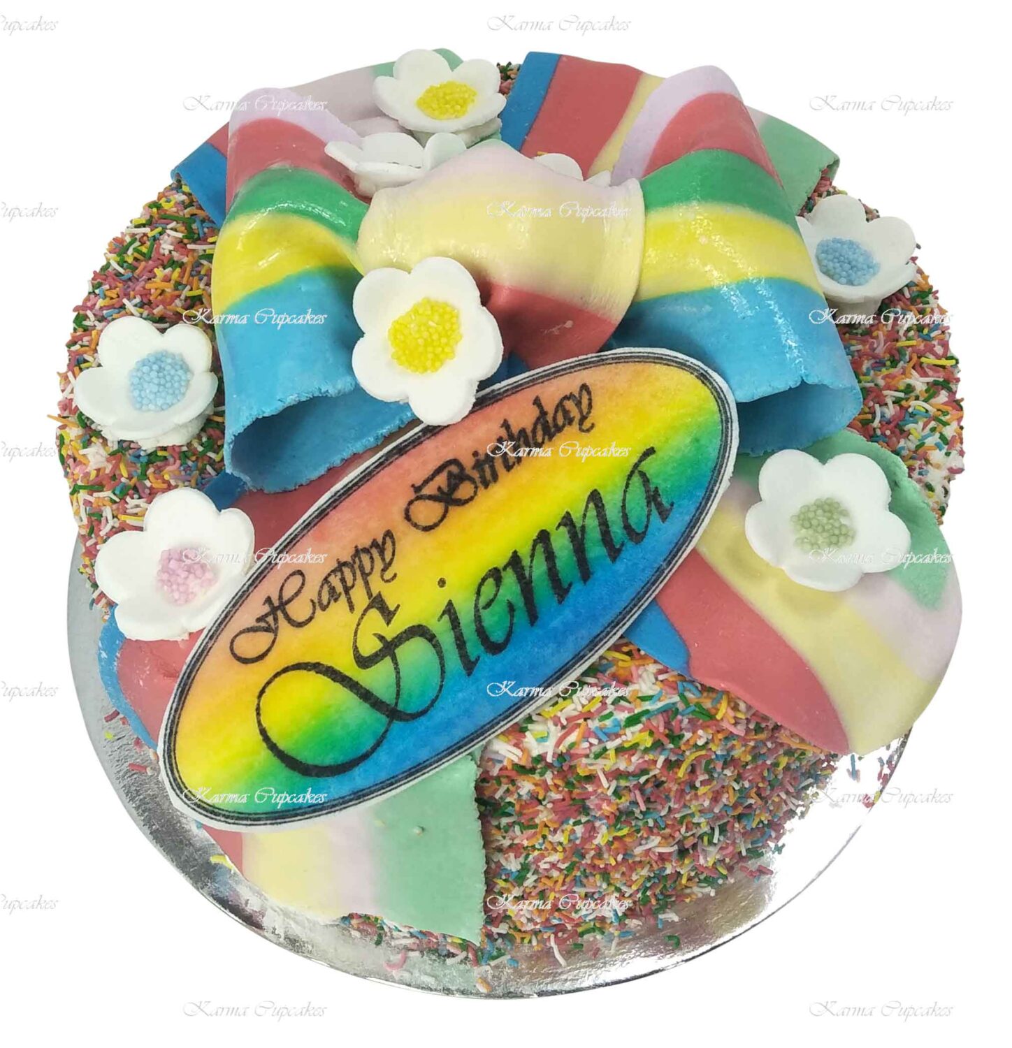Rainbow-edible-ribbon-and-flowers-hundreds-and-thousands