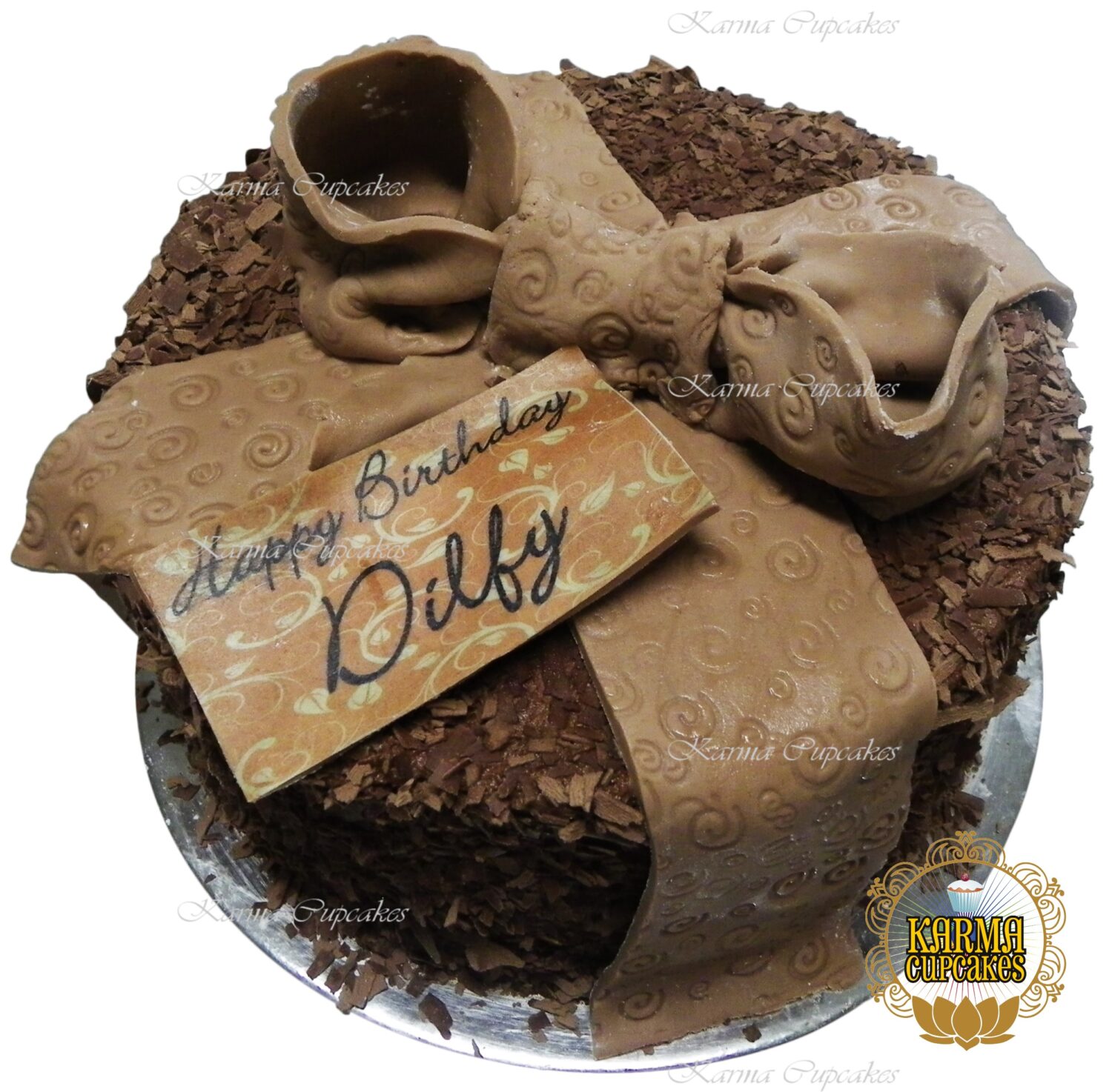 8" Chocolate mud cake coated with chocolate flakes (no sugar flowers and contains dairy)