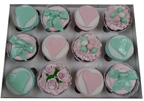 Pastel Cupcake Selection with roses, hearts and bow