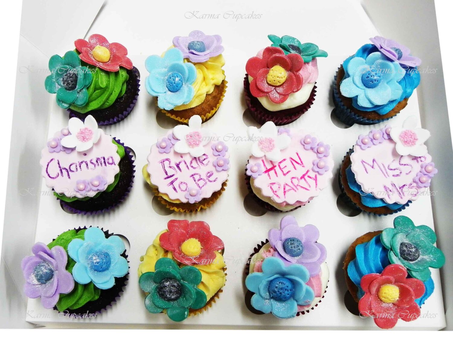 Hen's Night Cupcakes with bright colours, sugar flowers and 4 hand written plaques.