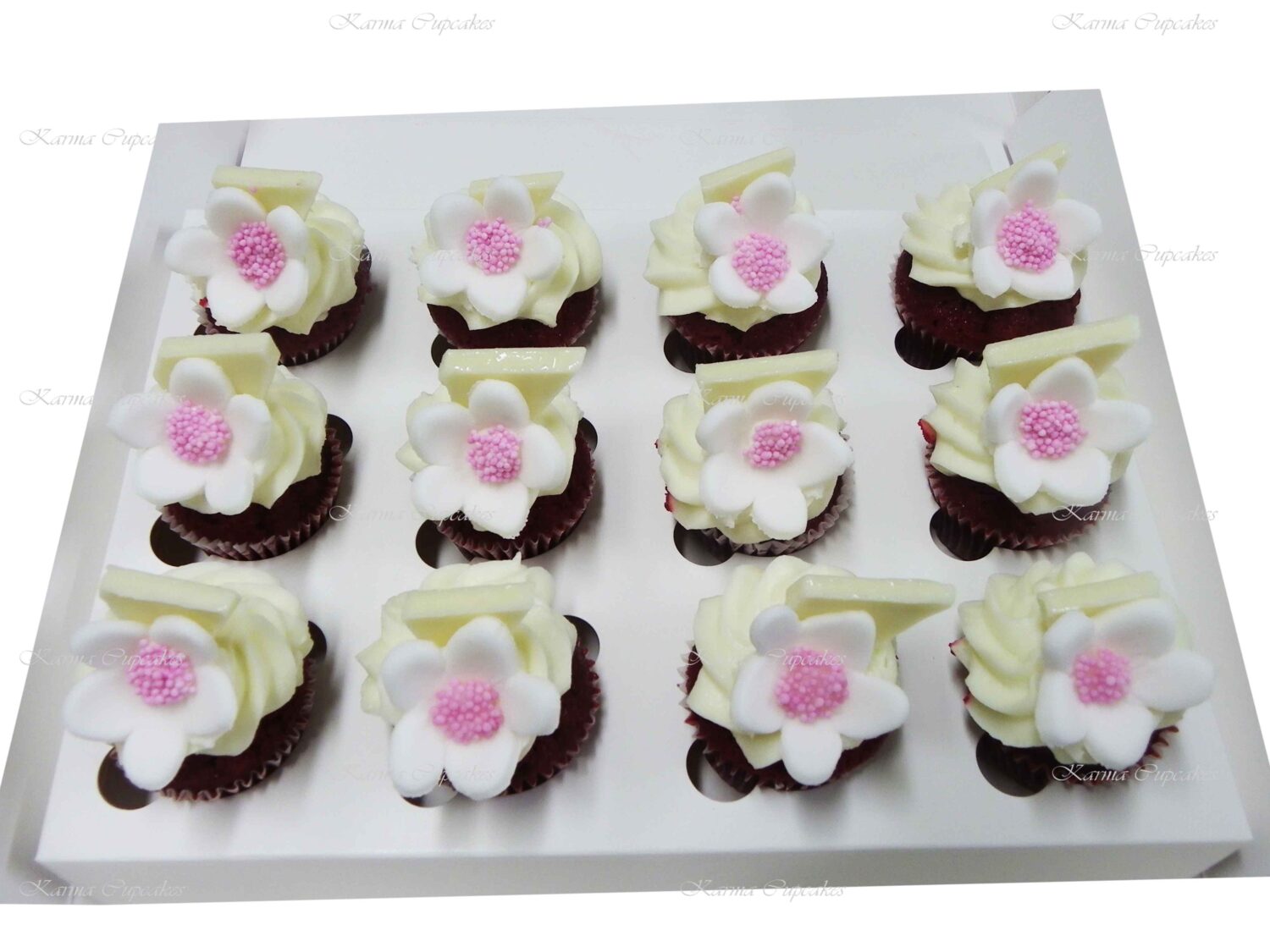 Red Velvet mini cupcakes with a sugar flower